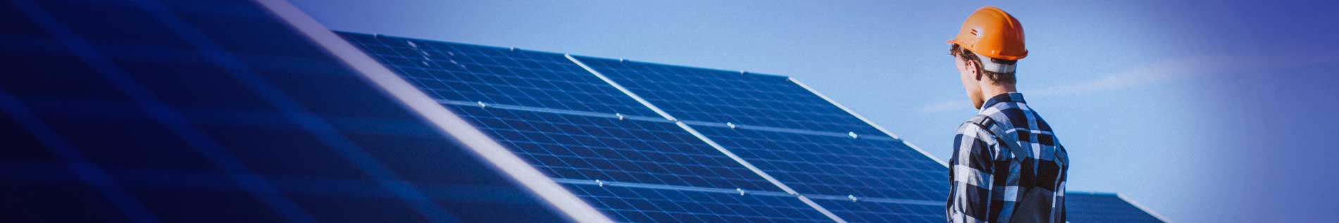 Solar Panels Cleaned by a Professional - image 2 of 2 showing a professional assessing a solar panel system